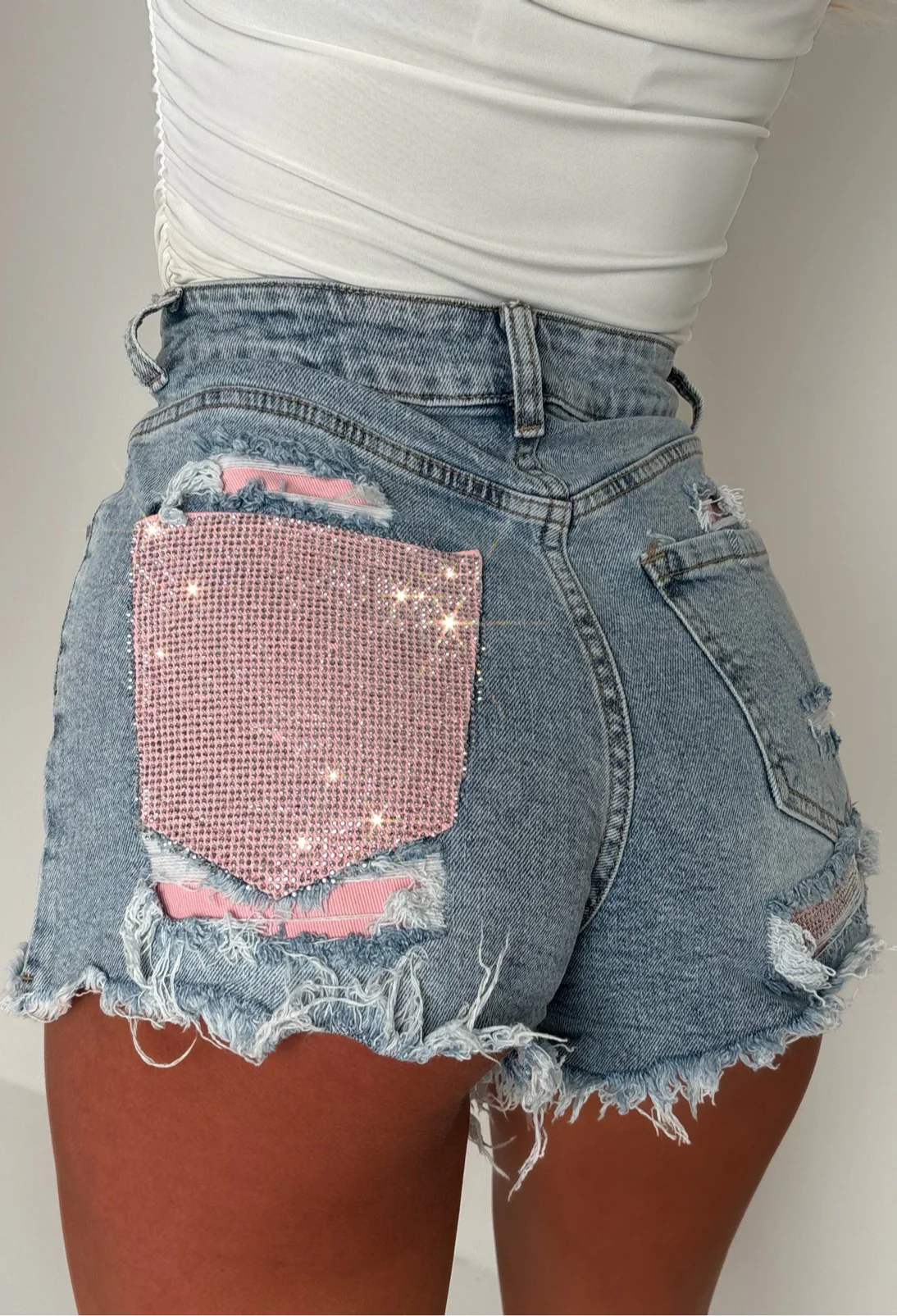 Bring On The Drama Mid Wash Ripped Denim Hot Fix Pink Pocket Shorts - Image 2